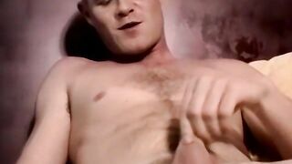 Good looking amateur guy strokes his big dick in the bedroom