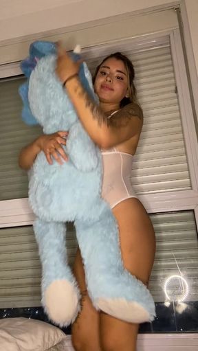 Adult video with woman holding blue teddy bear