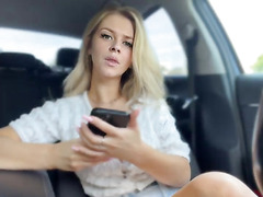 Sexy Blonde Teasing in Car with Cigarette