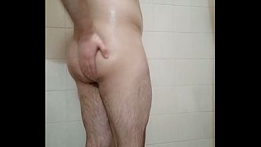 Muscular stud showers after his workout