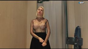 Young blonde shows off huge boobs in the fitting room