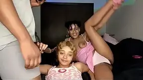 Two lesbians enjoy a steamy homemade session while playing with a big dick