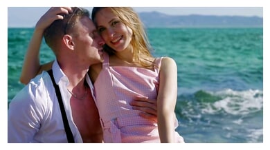 Blonde lover shares passionate beachside kisses and intimate 69 with her partner