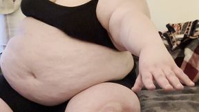 Massive immobile fatty fights against her huge sagging belly to try to touch her poor piggy feet — tries to sit up from lying down — panting and sweating and disabled by her own massive body — feedee SSBBW Marigold immobility can’t reach belly too big