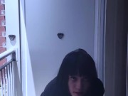 Hari smokes on her balcony