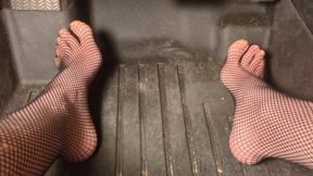 Fifi pedal pumping in sedan wearing fishnets