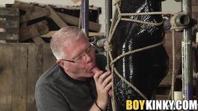 Helpless twink has his shaft stroked by older gay master