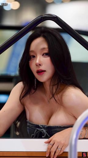 Curvy Korean girl shows off her cleavage while sitting alone