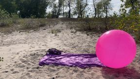 Play on pink shosu ball on beach