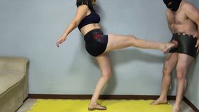 697 With his testicles fully exposed, Slade receives kicks to the groin until he falls to his knees.