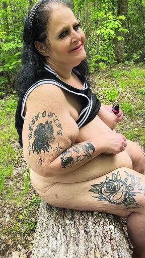 Sucking on a Straw in the Woods Squirting on Tree on Her Knees