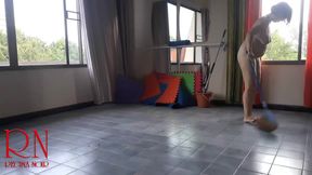 Nudist maid cleans the yoga room