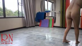 Nudist maid cleans the yoga room