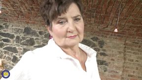 Hairy granny still loves to play with her damp snatch