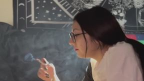 SEPTEMBER LYING DOWN IN A T-SHIRT SMOKING