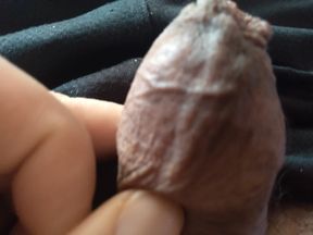 gay man rests next to his big penis