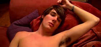 Slim twink blasts a cumshot on himself after