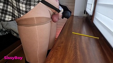 NYLON CUM. SISSY IN DRESS AND PANTYHOSE CUMS IN CHASTITY.