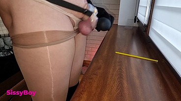 NYLON CUM. SISSY IN DRESS AND PANTYHOSE CUMS IN CHASTITY.