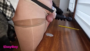 NYLON CUM. SISSY IN DRESS AND PANTYHOSE CUMS IN CHASTITY.