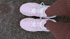 Showing New Balance and Converse Shoes on a Parking Lot