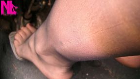 Pedal pumping in black pantyhose and red nailpolish