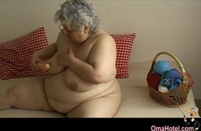 Nasty fat granny likes to satisfied her old cunt with sex toy