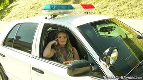 Hot porn actress Cali Carter gives an interview sitting in a police car