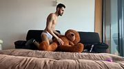 Skinny, big-cocked twink jerking off with his teddy bear while playing video games.