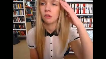 Slim and sexy blonde stripping in public library