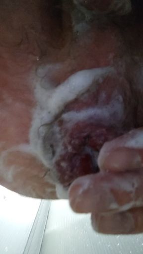Anal fisting in the shower