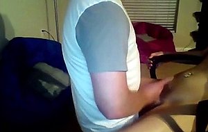 Young shemale getting a handjob by a dude