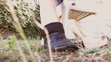 Her giant heels crush her foot slave all day in the garden