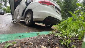 girl rocks the car from side to side, the car bumper bounces and shakes