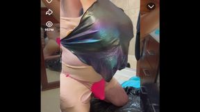 Sexy shemale wears shiny metallic halter top while masturbating