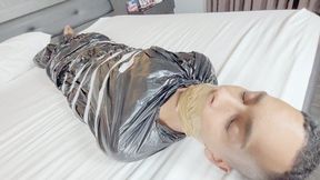 BABE AND BELLA CRUEL FARTING ON THE SLAVE TRAPPED IN PLASTIC WITH HIS MOUTH SEALED - CLIP FULL