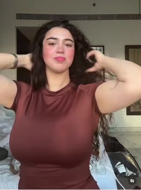 Curvy brunette in a red dress