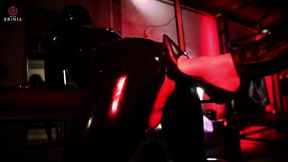 Submissive man dressed entirely in a latex suit is dominated and punished by Mistress Erinia copy