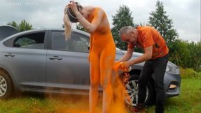 Young Eva was released naked into a field and painted with orange paint