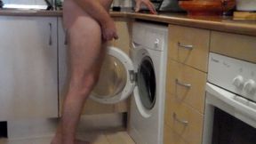 John is peeing all into the washing machine