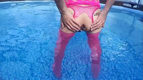 Sissy in pink, butt plug and pool