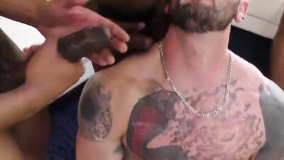 Three black studs are taking turns on white guy's bubble butt