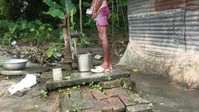 Black mature man bath in desi style. Showing big dick.