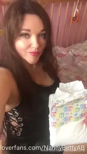 Nanny Betty is ready to put your diaper on you.