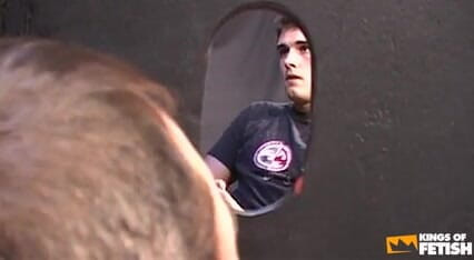 Young dude masturbates and cums in a guy's mouth through glory hole
