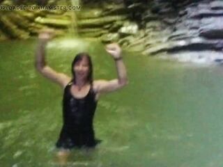 Alexa Cosmic transgirl swimming at waterfall in shirt and t-shirt... first waterfall