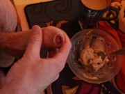 A guy jerks off his hairy dick and cums a lot into the ice cream he feeds his friend. Cum in food