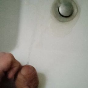 College: Student with a big fat cock pissing in the sink in a public toilet