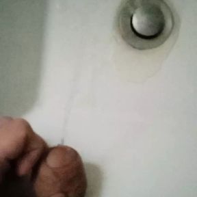 College: Student with a big fat cock pissing in the sink in a public toilet