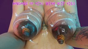 Bondage of tits with zip ties